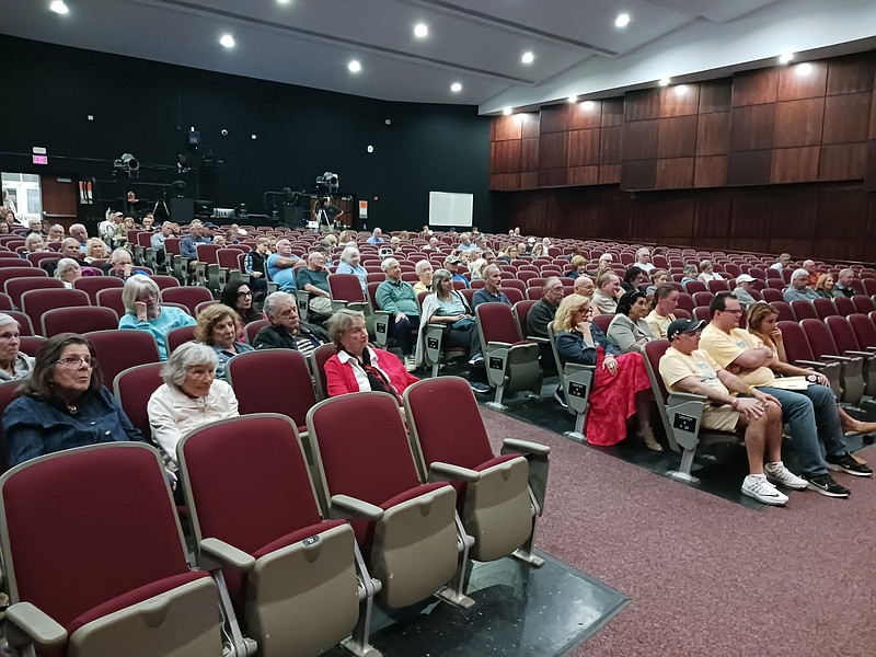 Audience members listen to the candidates at the Bill and Nancy Hughes Performing Arts Center at Ocean City High School.