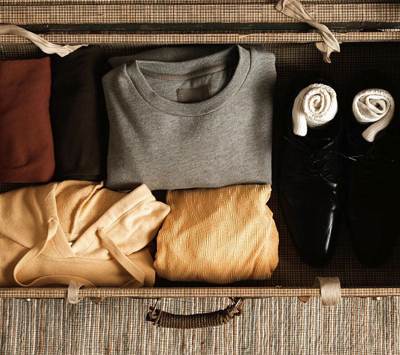 Image source - https://www.freepik.com/free-photo/top-view-vintage-suitcase-with-casual-clothes_9243661.htm