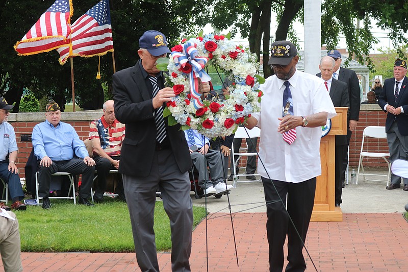 The presentation of the wreath by John Kocher of American Legion Post , left, 524 and Ron Williams of Post 6650.