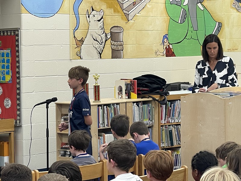 Gavin Gesler awaits the word to spell from the proctor Dr. Curt Nath.