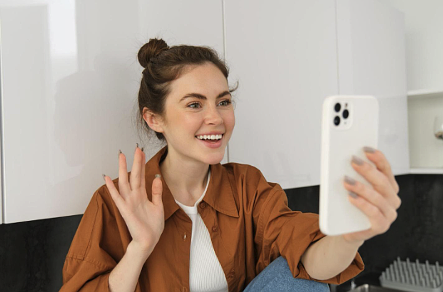 Image credit - https://www.freepik.com/free-photo/portrait-young-cheerful-woman-laughing-smiling-phone-call-video-chats-with-friend-sits_84692644.htm