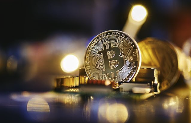 Image source - https://unsplash.com/photos/a-bitcoin-sitting-on-top-of-a-computer-chip-8TEpTK7363I