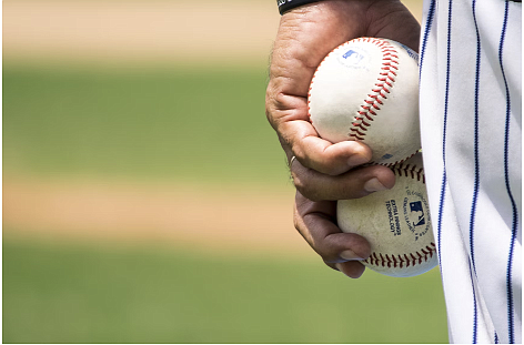 Image source - https://unsplash.com/photos/person-holding-two-baseballs-3k_FcShH0jY