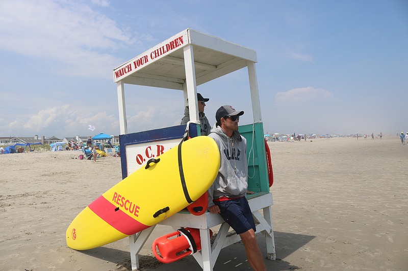 Lifeguards keep their eyes on bathers during a busy July 6 day.