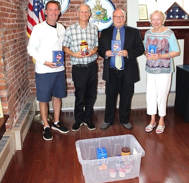 Froom left, Mayor Jay Gillian, aide to the Mayor Michael Allegretto, President of the Ecumenical Council Jack Shea and Assistant Food Cupboard manager Carol Evans ask the community to donate food in Regina Ralston's memory. (Photo courtesy of Ocean City)