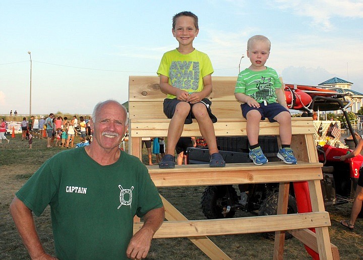 The Sea Isle City Beach Patrol and many other safety organizations will offer hands-on displays during Sea Isle’s National Night Out celebration on August 2.  Shown with youngsters during 2015’s National Night Out is SICBP Captain Renny Steele.