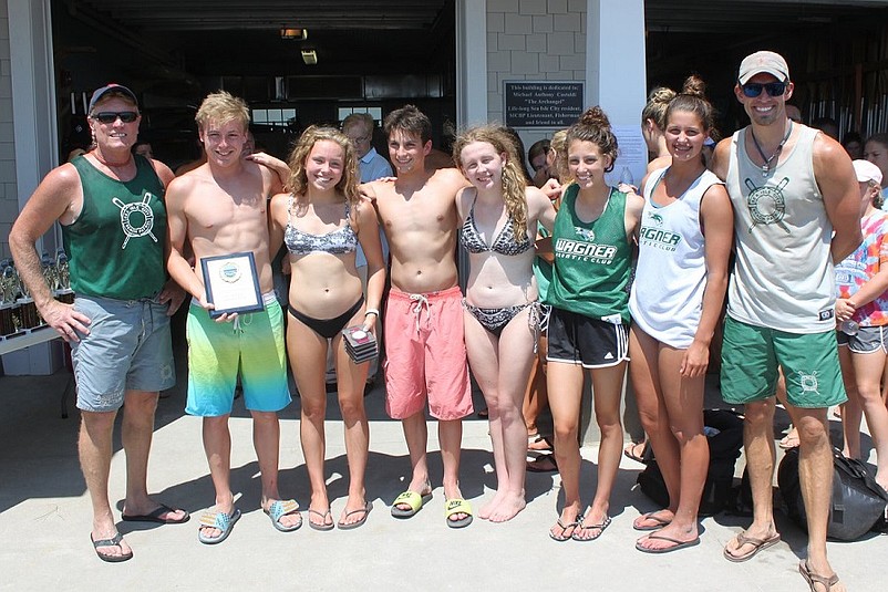 Members of the Wagner Aquatic Club in Staten Island, NY, took home the first place prize in the “Swim Club” team division during the Sea Isle City Beach Patrol’s annual 1-Mile Ocean Swim on July 23. The winners are shown with SICBP Assistant Captain John Temme (far left) and SICBP Senior Guard Dave Novak, race organizer (far right). 