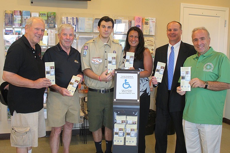 Matthew Baldini, 17, of Boy Scout Troop 76, is shown inside Sea Isle City’s Welcome Center displaying his Eagle Scout Project with (from left) City Council President Bill Kehner, Councilman John Divney, his mother Heather Baldini, his father Paul Baldini, and Mayor Leonard Desiderio. 