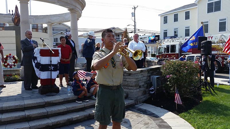 Eagle Scout Forest Wan, of Troop 76, played "Taps" in remembrance of the 9/11 victims.