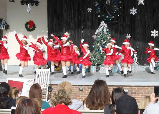 Dancers kick up their heels to entertain the crowds.