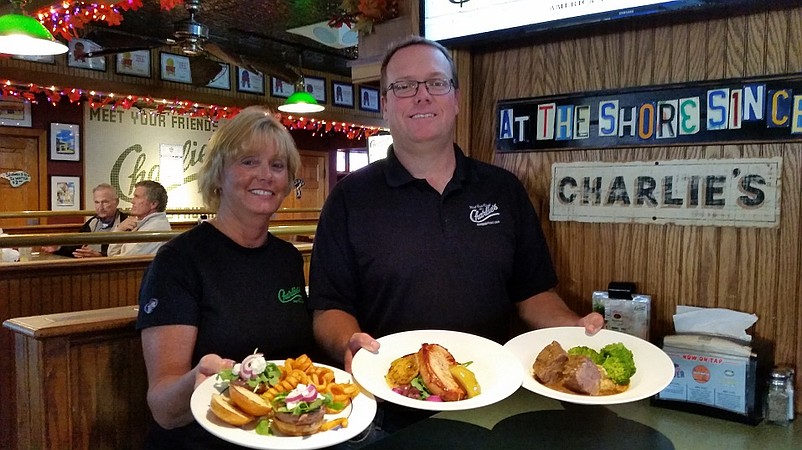 Waitress Donna Mirsh and owner Jeff Thomas show off the lunch specials at Charlie's Bar & Restaurant during Somers Point Restaurant Week.