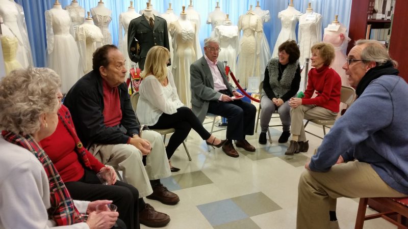 Mike Stafford, center, a former president of the Historical Society, talks with other members.