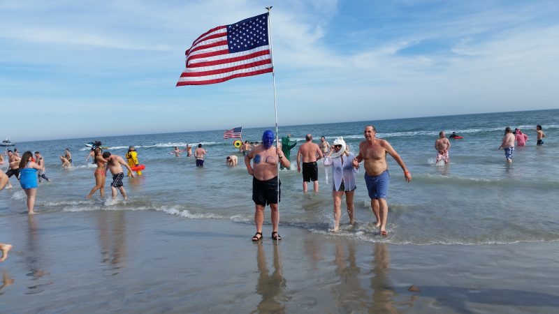 Tom Robinson, 70, of Philadelphia, painted his face blue and carried a large American flag.