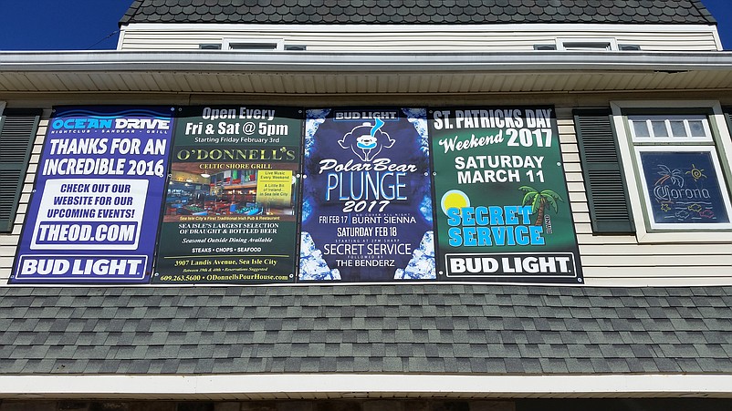 The Ocean Drive bar uses a Polar Bear Plunge-themed sign to advertise its entertainment lineup.