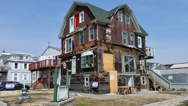 An old house at the corner of 44th Street and Pleasure Avenue owned by local builder Joseph D. McCann's family is being lifted above flood level.