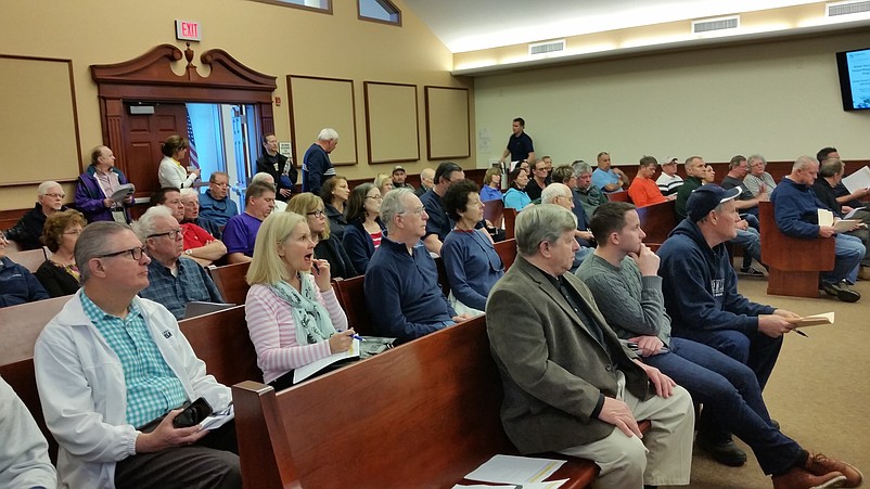 Residents from four Cape May County seashore towns listen to details about how to apply for grants to elevate their homes.