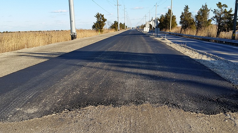 A fresh coat of asphalt was put down this week, giving a glimpse of what the new roadway will look like when it's finished this fall.