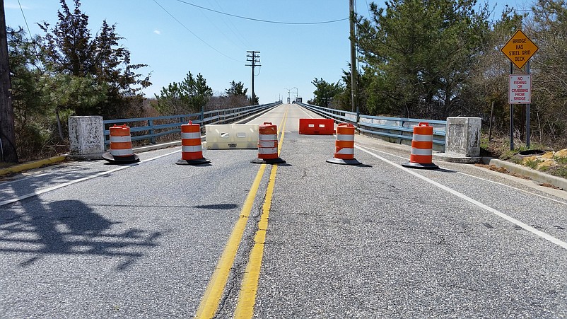 Motorists are greeted by barriers blocking access to the bridge, which is closed indefinitely for emergency structural repairs.