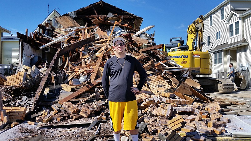 Robert Noble, a former Sea Isle resident who recalled having Boy Scout meetings in the old firehouse, poses in front of the building's remnants.