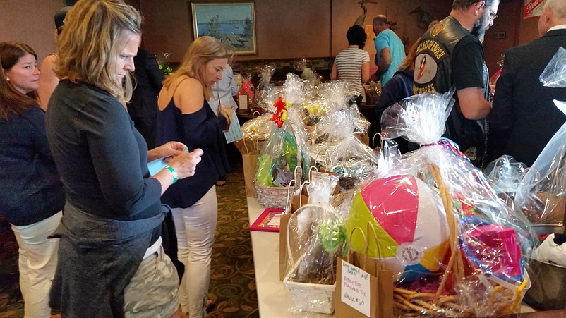 Gift baskets donated by local businesses were raffled off during the fundraiser benefiting Christie Hess' two young daughters.