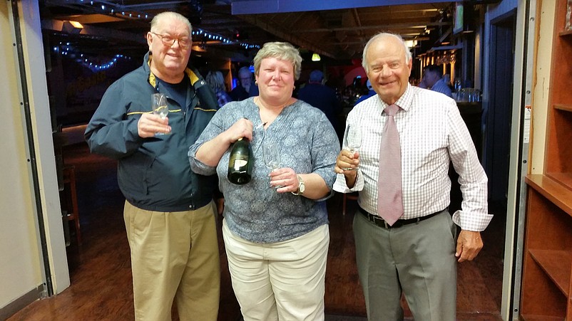 Feeley, Tighe and Gibson celebrate their 2017 election victory with a champagne toast.