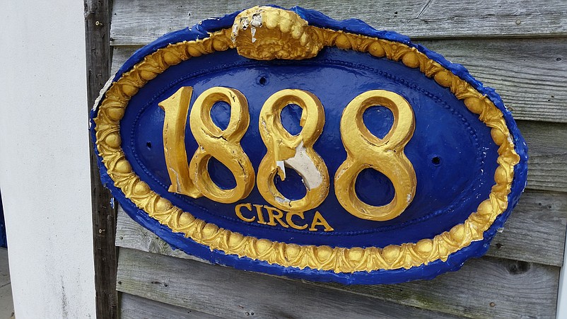 A plaque on the facade of the civic center indicates the building dates to 1888.