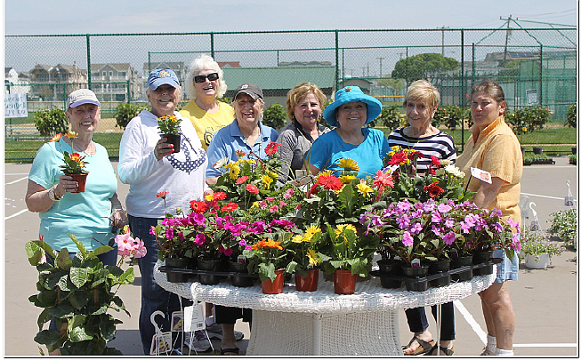 The members of Sea Isle City’s Garden Club will host their annual Flower Sale Fundraiser. Proceeds from the event will support the club’s charitable efforts.  Shown during a previous Flower Sale are members (from left) Mary Tighe, Eleanor Mooore, Ann Organ, Monica Santarchangelo, Rose Divney, Kathy Wilson, Janice Gheysons, and Donna Hadfield.