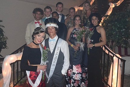 Prom Prince and Princess, Dom Monteleone and Bridget McMenamin, with the prom court behind them