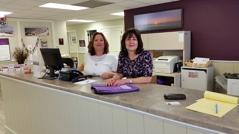 Sales associate Irene D'Innocenzo joins Carol Hopely Russo at the front counter.