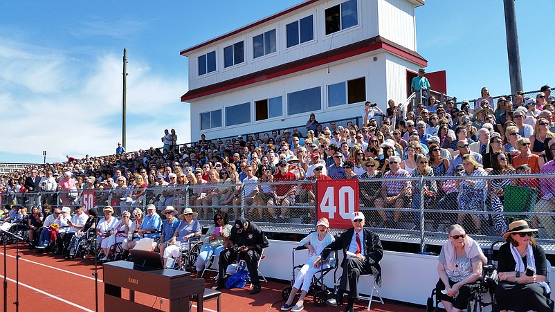 Crowds packing the grandstand at Carey Stadium watch the commencement ceremony.