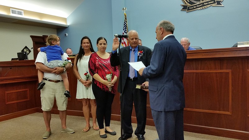 Councilman Jack Gibson takes the oath of office from Mayor Desiderio.