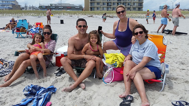 Stephanie and Kris Kaufmann, of Philadelphia, and their daughters, Alexis and Ella, spend time on the beach with Lorraine Corvino, in dark blue top, and Kaufmann's mother, Patti Karam, of Allentown, Pa.