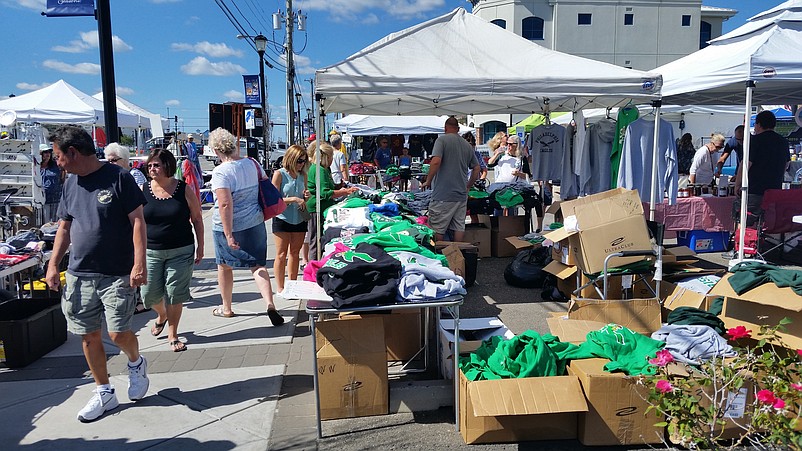 Shoppers browse at the array of vendors selling Irish-themed clothing and other items.