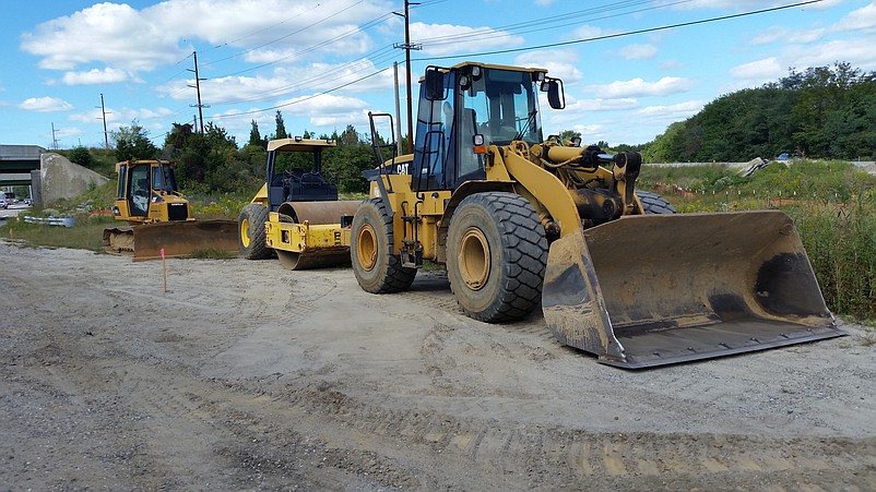 Heavy construction equipment stands ready for the next phase of the project.