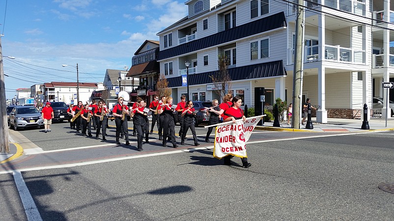 The Ocean City High School Red Raider Marching Band provides the parade music.