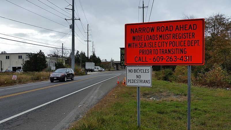 A sign warns motorists of the narrow roadway as they approach the construction zone on Sea Isle Boulevard.