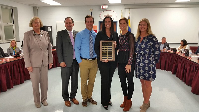 From left, Superintendent of Schools Kathleen Taylor, Board of Education President Joseph Clark, technology teacher Randall Kohr, third grade teacher Mary Beth Libro, first grade teacher Carrie Merritt and Ocean City Primary School Principal Cathleen Smith.