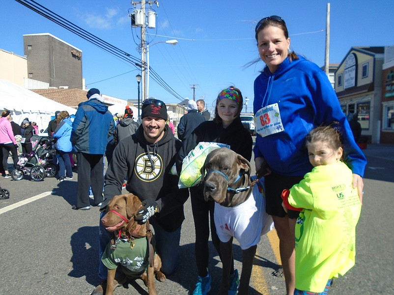 Jeff LeFrance and his wife Christine Czaja, of Seaville, with children Riley, 10, and Skylar, 5, participate in the autism walk in honor of Czaja's son Bode, who passed away in 2014.