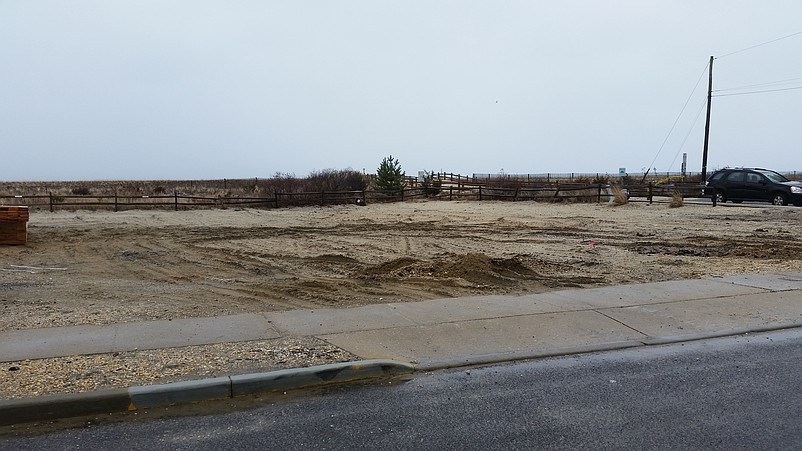 Beachfront property on Pleasure Avenue once occupied by the two duplexes destroyed by fire is now empty land.