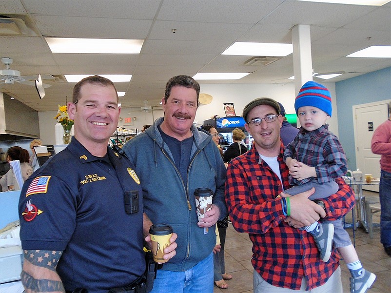 Sgt. John Saltzman with Ron Custer and Officer Tully O'Clisham and son Declan.