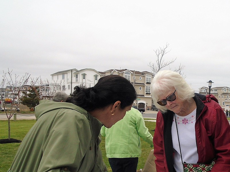 Green Team member Vicki Feeney helps Anne Organ with her seedling selection at Sea Isle's Arbor Day celebration in 2018.