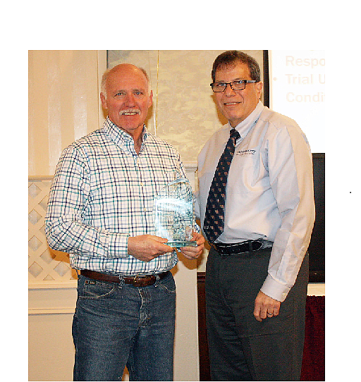 Sea Isle City Beach Patrol Captain Renny Steele (at left) is shown receiving a Special Safety Recognition Award from Robert Holwitt, CSP, of J. A. Montgomery Risk Control, during the Atlantic County Municipal Joint Insurance Fund’s annual Safety Breakfast in March.