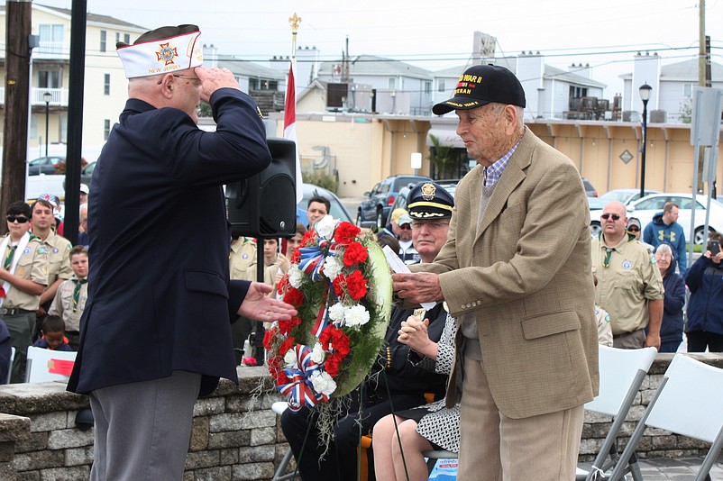 Patriotic hymns will be sung and wreaths will be dedicated in honor of America’s fallen military heroes during Sea Isle City’s annual Memorial Day Ceremony on May 28.  Shown during last year’s ceremony are VFW Post 1963 Commander Charles Haines (at left) and World War II Veteran Bill Johnson. (Courtesy of Sea Isle City)