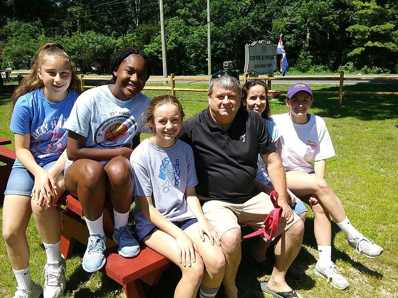 Retired Bishop McHugh girls basketball coach Tom Andress with former players from left Adriana Rivera and Xiomara Walker, his daughter Sam and Becky and wife Nettsey.