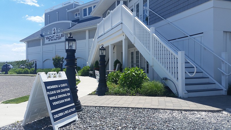 A sign urges members and guests of the Yacht Club of Sea Isle City not to speed on Venicean Road.