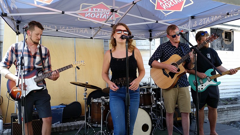 The band Devin Lyn &amp; Whiskey Tango Foxtrot provides the entertainment at the beer festival.