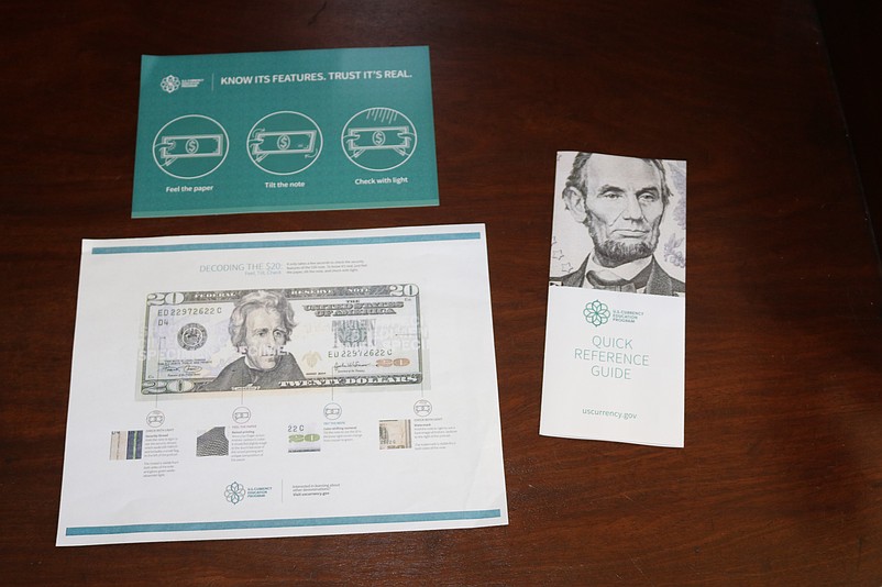 Pamphlets from the U.S. Currency Education Program help the public tell the difference between real and phony money.