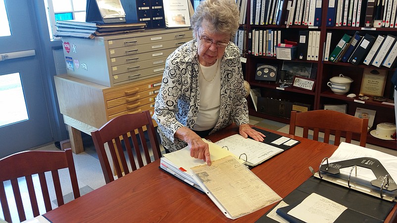 Museum volunteer Shirley Gill points to a 1918 newspaper article that contains the shocking headline that Sea Isle's mayor "vanishes."