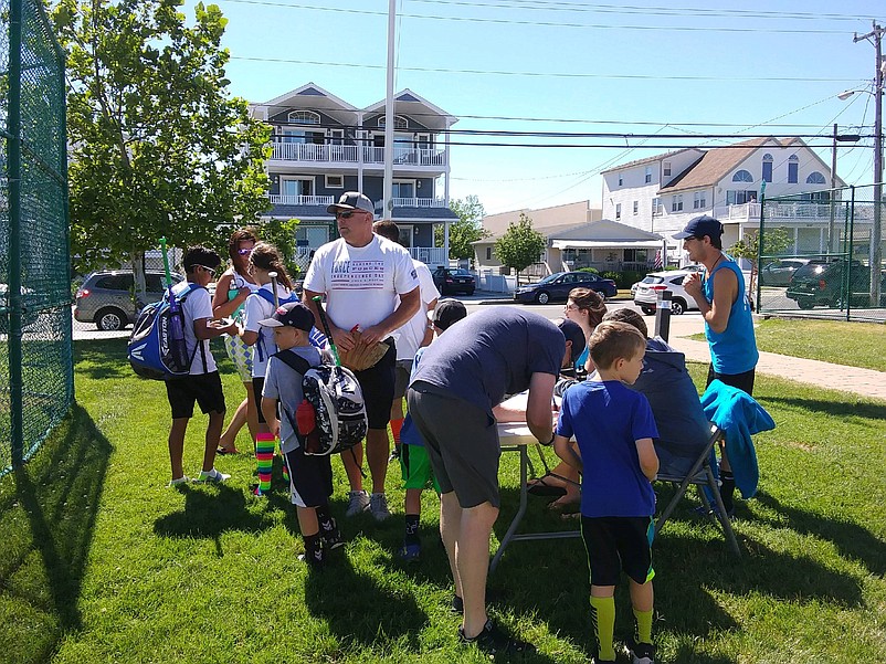 Kids line up with their parents and guardians to register for the fun event.