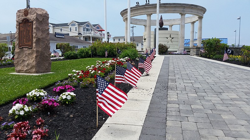 Miniature American flags lining the walkway at Veterans Park create a patriotic scene for the Fourth of July.